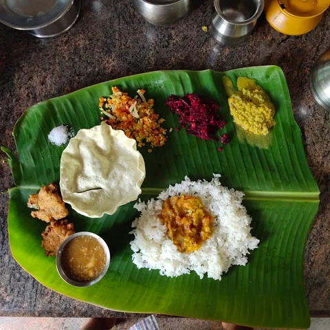 Local Food in Andhra Pradesh | Safari Sutra Holidays Authentic Andhra banana leaf thali — local food experience on Andhra Pradesh tour | Safari Sutra