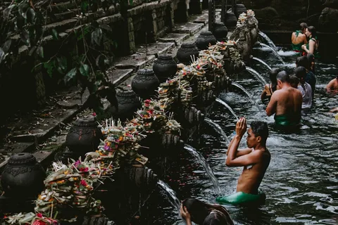 Balinese Temple Culture | Safari Sutra Holidays Balinese Hindu temple ceremony with flower offerings — cultural experience in Bali tour packages from Mumbai