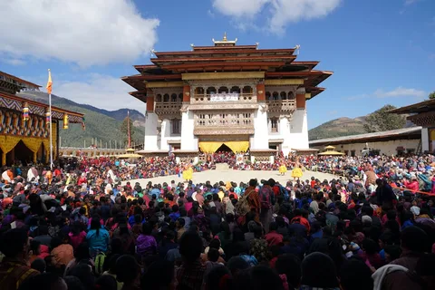 Bhutan Tshechu Festival and Dzong Culture | Safari Sutra Holidays Buddhist monks at Bhutanese dzong during tshechu festival — cultural experience on Bhutan tour