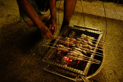 Local Khmer Food in Cambodia | Safari Sutra Holidays Traditional Khmer fish amok and street food at Siem Reap market Cambodia | Safari Sutra Holidays