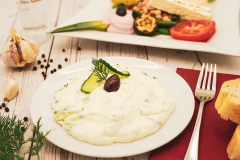 Greek Cuisine & Local Food | Safari Sutra Holidays Greek mezze spread with fava dip, olives and fresh bread — local food in Greece for Indian travellers