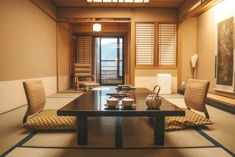 Ryokan Stay in Japan | Safari Sutra Holidays Traditional Japanese ryokan with tatami floor and garden view — Japan hotel packages | Safari Sutra