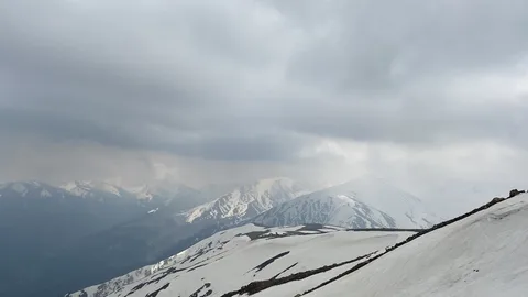 Gulmarg Gondola Kashmir | Safari Sutra Holidays Gulmarg gondola cable car above snow-covered Himalayan slopes — Kashmir winter tour Safari Sutra