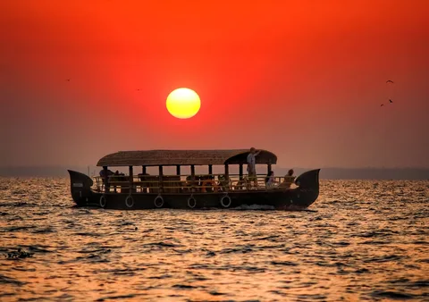 Luxury Houseboat Stay Kerala | Safari Sutra Holidays Luxury houseboat interior on Kerala backwaters — handpicked floating stay for Kerala tour packages