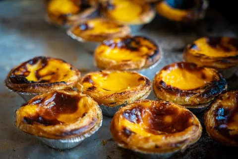 Macau Street Food and Egg Tarts | Safari Sutra Holidays Macau Portuguese egg tarts and street food on Rua do Cunha, Taipa Village — local food experience