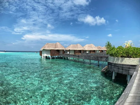 Overwater Villa Resorts in the Maldives | Safari Sutra Holidays Luxury overwater villa with ocean deck and turquoise lagoon — Maldives resort stay | Safari Sutra