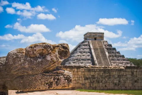 Chichen Itza Mayan Ruins | Safari Sutra Holidays Tourists exploring Chichen Itza Mayan ruins at dawn, Mexico tour packages | Safari Sutra Holidays
