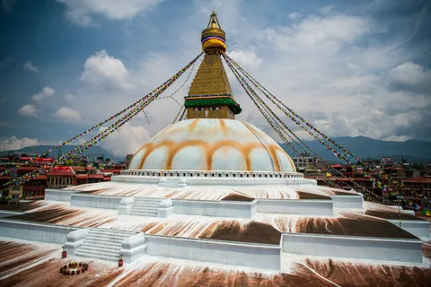 Boudhanath Stupa Kathmandu Culture | Safari Sutra Holidays Buddhist monks circling Boudhanath Stupa in Kathmandu Nepal — cultural tours India | Safari Sutra Holidays