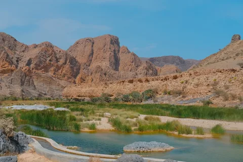 Wadi Shab Canyon Swimming, Oman | Safari Sutra Holidays Turquoise wadi canyon pool in Oman — wadi swimming on Oman tour packages from India by Safari Sutra