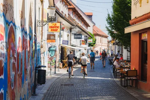 Ljubljana Old Town Cultural Walk | Safari Sutra Holidays Ljubljana Old Town historic architecture and riverside — cultural experience on Slovenia holiday packages | Safari Sutra