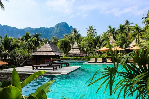 Boutique Resort Stays in Thailand | Safari Sutra Holidays Luxury resort infinity pool overlooking jungle in Thailand — curated stays for Indian travellers | Safari Sutra Holidays