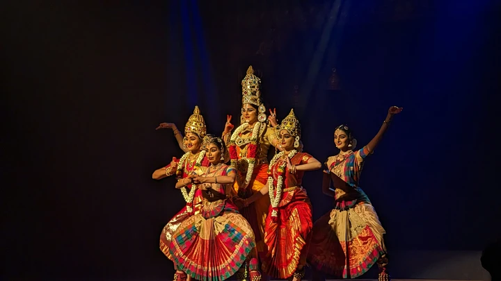 Authentic Cultural Experiences — Beyond Tourist Traps Traditional Bharatanatyam dancer in vibrant costume performing authentic classical Indian dance with graceful expressions