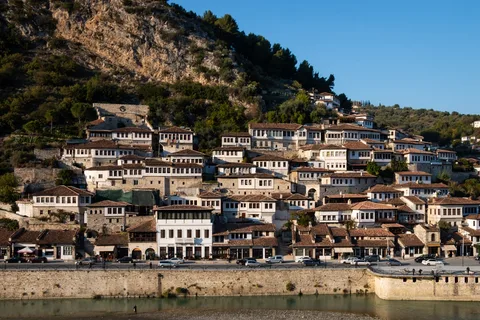 Albania Cultural Immersion: Tirana, Berat & Gjirokastër | Safari Sutra Holidays Berat Albania UNESCO hillside white Ottoman houses — Albania cultural tour package from India | Safari Sutra