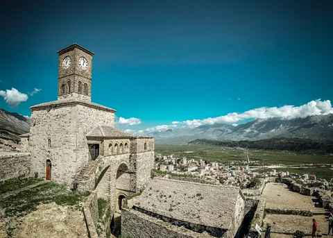 Albania Family Tour: Castles, Coast & the Ionian Blue | Safari Sutra Holidays Berat Albania castle family walk cobblestone hill — Albania family tour package from India | Safari Sutra