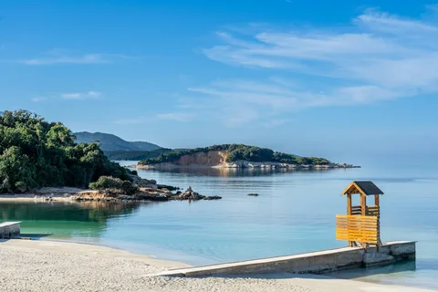 Riviera on a Shoestring: Albania & Lake Ohrid Budget Explorer | Safari Sutra Holidays Turquoise water and islands at Ksamil on an Albania tour package from India