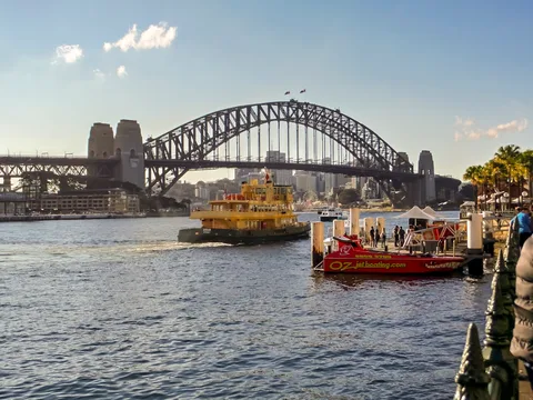 Australia Easy Discovery: Sydney & Melbourne for Senior Travellers | Safari Sutra Holidays Sydney Harbour ferry approaching Circular Quay with Opera House — Australia senior tour from India