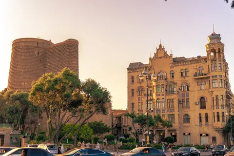 Azerbaijan Honeymoon: Flame City, Silk Road Palaces & Caspian Evenings | Safari Sutra Holidays Romantic lantern-lit lane in Baku Old City at dusk — Azerbaijan honeymoon package from India