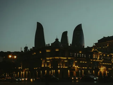Fire Temples to Snowy Peaks: Baku & Georgia Family Holiday | Safari Sutra Holidays Baku's Flame Towers lit up at night on an Azerbaijan Georgia family tour package