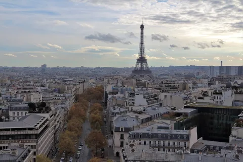 France on the Essentials: Paris & a Loire Valley Day Trip | Safari Sutra Holidays Paris street view with Eiffel Tower in background — France budget tour package India