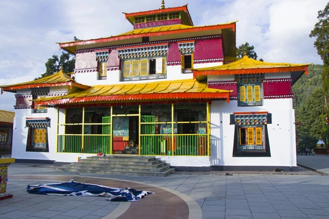 The vibrant red and yellow facade of the Tibetan Buddhist Monastery in the hill station of Nainital, Uttarakhand