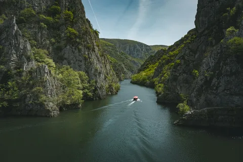 Caves, Canyons & the Black Sea: Georgia Family Holiday | Safari Sutra Holidays Boat on the emerald water of Martvili Canyon on a Georgia family tour package from India