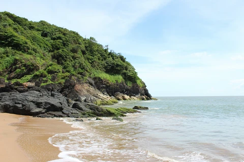 Gokarna — Om Beach Gokarna coastline with Om Beach crescent and palm-fringed shore