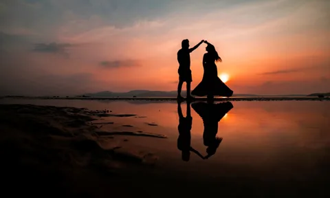 Gujarat Honeymoon: Salt Deserts, Palace Nights & Heritage Ruins | Safari Sutra Holidays Couple walking on white Rann of Kutch salt flats at sunset — Gujarat honeymoon package from India