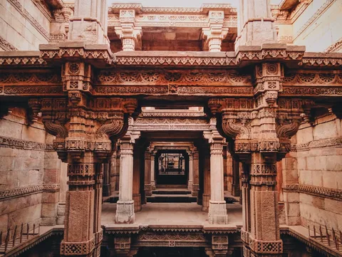 Gujarat Through the Lens: Stepwells, Salt & the Last Lions | Safari Sutra Holidays Looking down through the carved tiers of Adalaj Stepwell in Gujarat — Gujarat photography tour from India