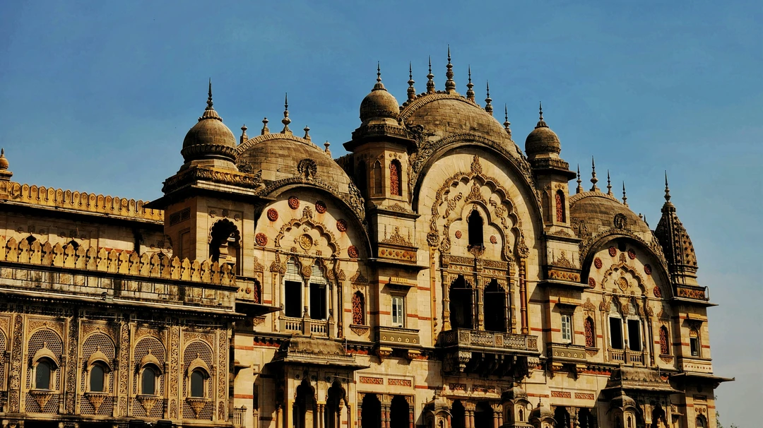 A detailed view of the magnificent and intricately carved facade of the Laxmi Vilas Palace, the royal residence in Vadodara