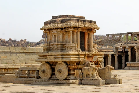 The Iconic Stone Chariot of Hampi, Karnataka The famous Stone Chariot, an intricately carved monolithic shrine with stone wheels, located in the courtyard of the Vittala Temple in Hampi