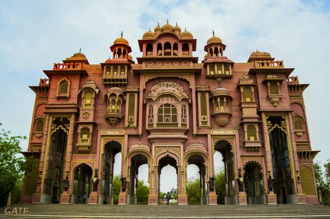 The Colorful and Ornate Patrika Gate in Jaipur The grand facade of the Patrika Gate in Jaipur, showcasing its vibrant pink color, intricate archways, and traditional Rajasthani design