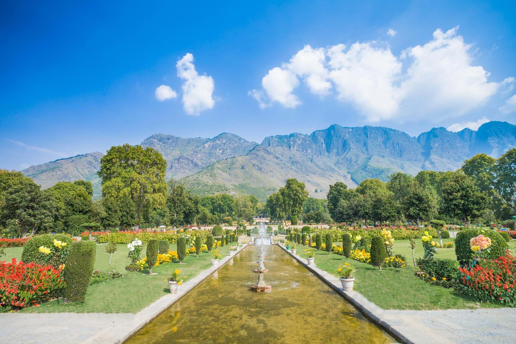 Peaceful terrace of Nishat Bagh Mughal garden overlooking Dal Lake Kashmir — senior tour