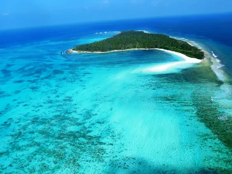 Lakshadweep Family Lagoon Escape | Safari Sutra Holidays Turquoise Lakshadweep lagoon aerial view — family island holiday package from India | Safari Sutra