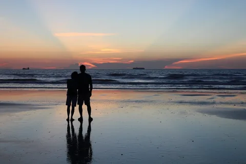 Lakshadweep Honeymoon in Blue | Safari Sutra Holidays Couple on private island beach at sunset — Lakshadweep honeymoon package India | Safari Sutra