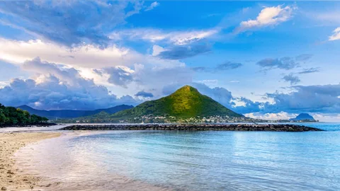 Mauritius at an Easy Pace: 4 Nights, One Base, No Rushing | Safari Sutra Holidays Calm morning at Grand Baie beach on a Mauritius senior-friendly holiday package