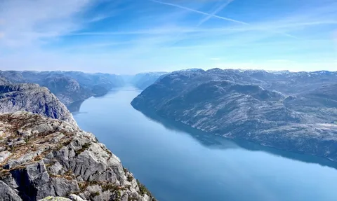 Pulpit Rock, Trolls & Fjord Goats: Norway Family Fjord Holiday | Safari Sutra Holidays Family at Pulpit Rock high above the Lysefjord on a Norway family tour package