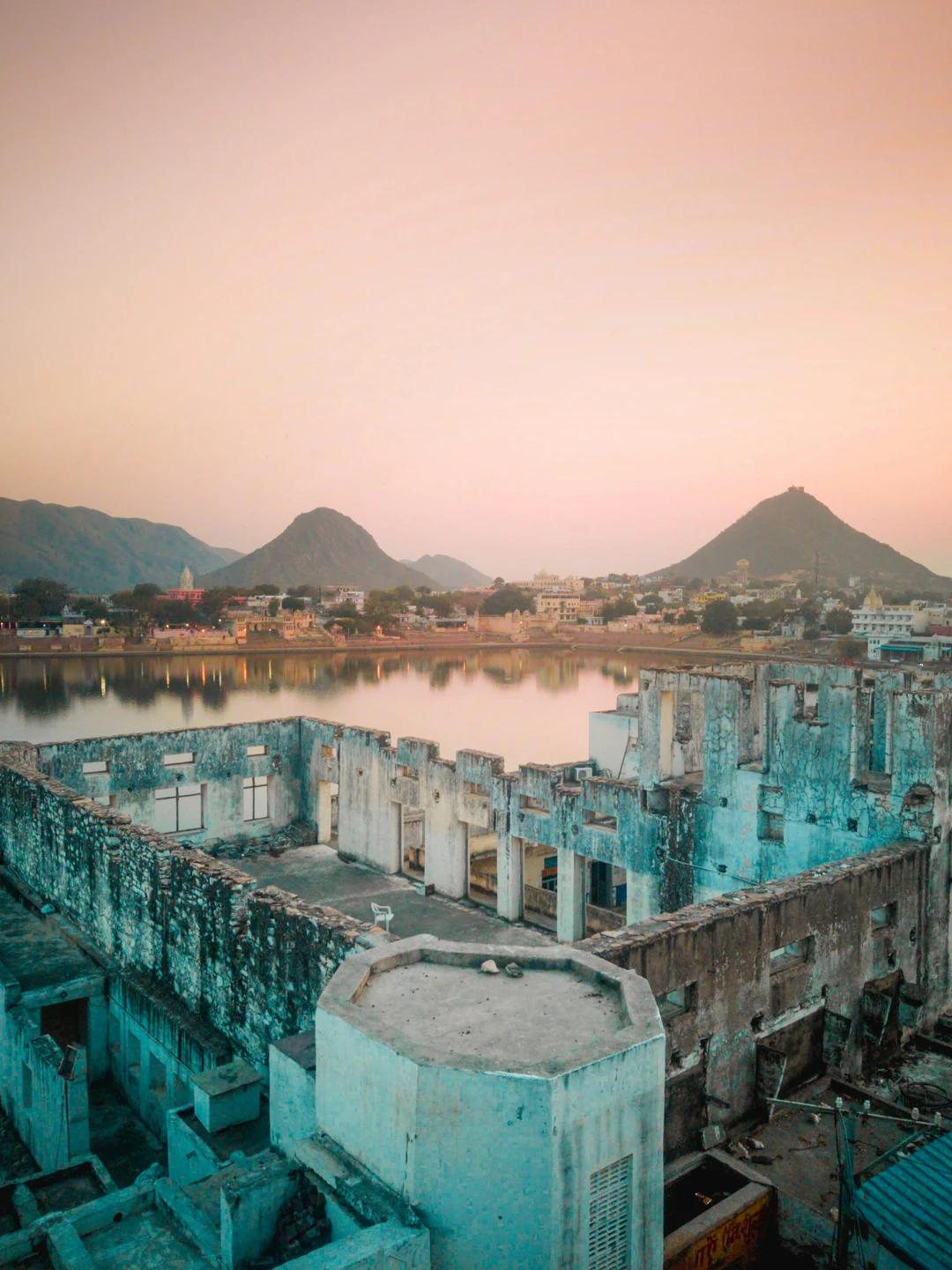 Pushkar Lake ghats with pilgrims and colorful reflections