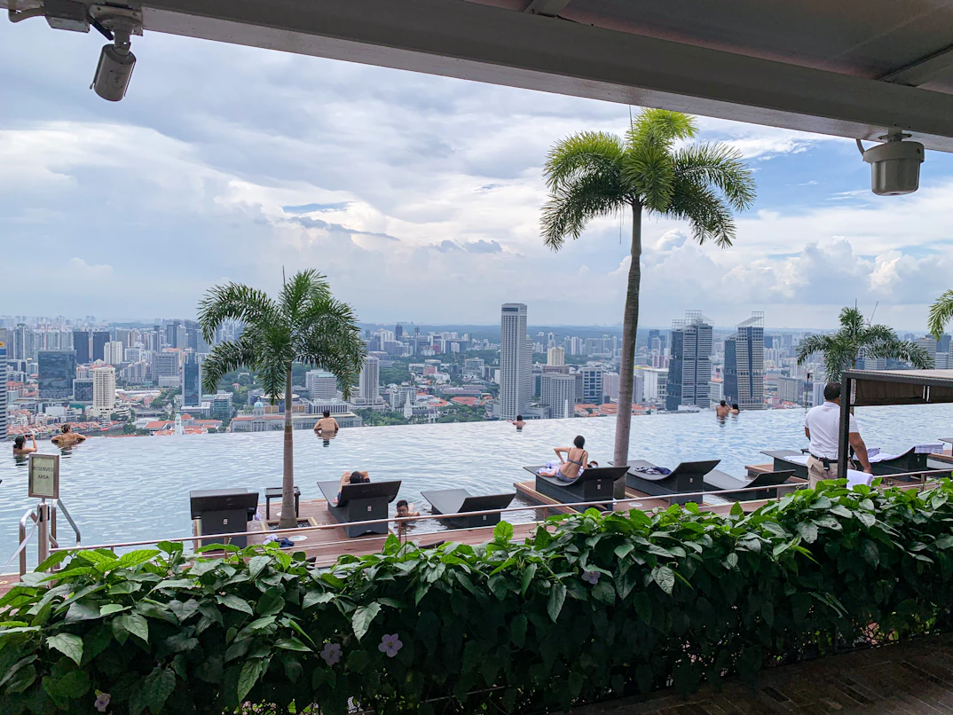 Singapore in Style: 3 Nights at Marina Bay Sands with Private Dining & SkyPark Access | Safari Sutra Holidays Marina Bay Sands infinity pool with Singapore skyline — Singapore luxury package from India