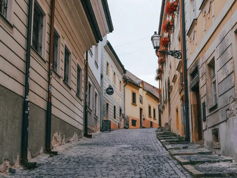 Slovakia Senior-Friendly Escape: Bratislava, Wine & Piešťany Spa | Safari Sutra Holidays Quiet cobblestone lane in Bratislava Old Town in the morning light, Slovakia senior tour from India
