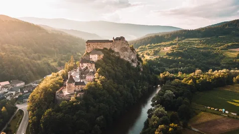 Slovakia Family Castle & Tatra Adventure | Safari Sutra Holidays Orava Castle perched on a rocky cliff above the Orava River, Slovakia family tour package from India