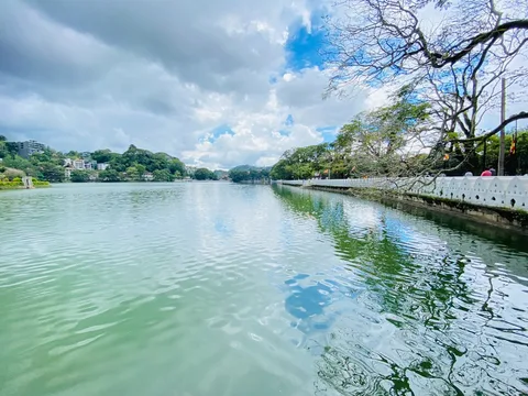 Sri Lanka at Leisure: Colombo, Kandy & the Golden Hills | Safari Sutra Holidays Kandy Lake at dawn with the Temple of the Tooth Relic reflected in still water — Sri Lanka senior tour