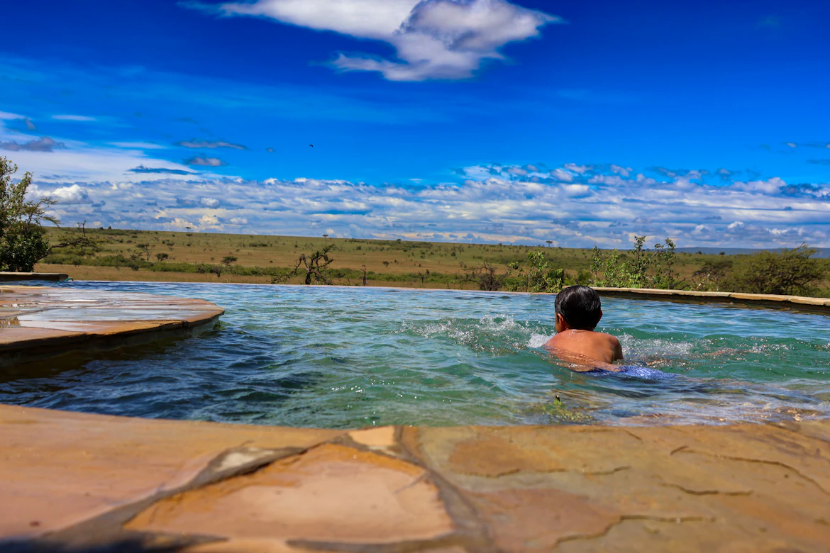 Luxury safari tent with private plunge pool overlooking the Tanzania savanna — premium 5-star safari package from India