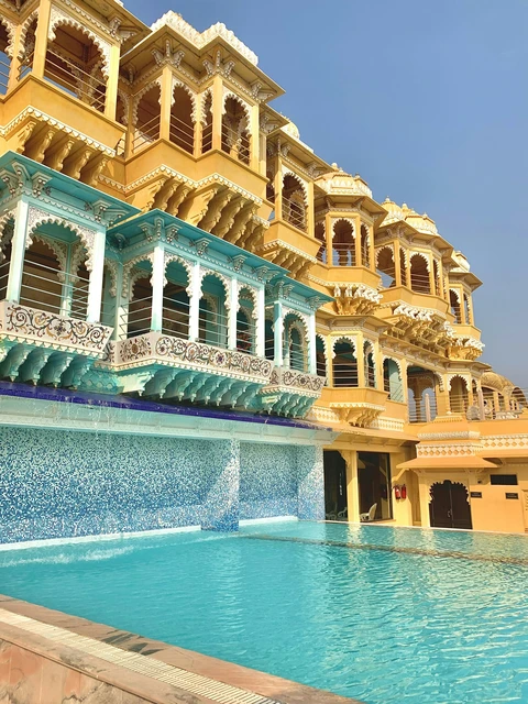 The Luxurious Chunda Palace Hotel in Udaipur The stunning swimming pool at the Chunda Palace hotel in Udaipur, overlooked by the hotel's ornate, colorful Rajasthani balconies