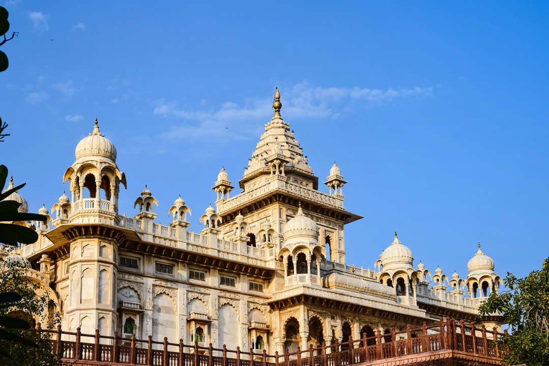 The magnificent facade of the Albert Hall Museum, the oldest museum in Rajasthan, with its intricate domes and towers against a blue sky